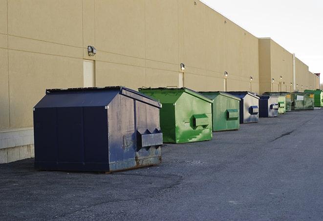 conveniently located dumpsters for construction workers use in Garrison, TX