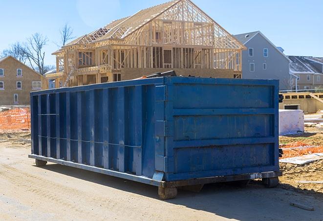 a large waste container positioned on a residential street